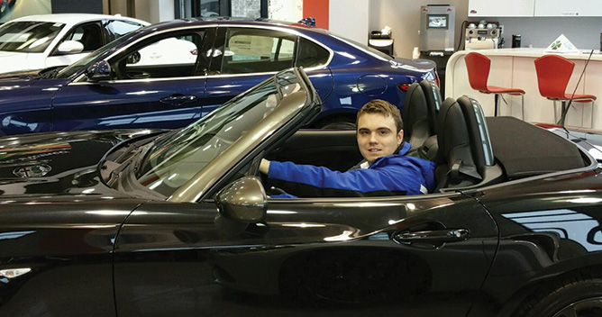 Forum student behind the wheel of a Ramsey automobile