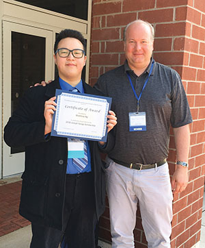 Matthew Ng, left, with Principal Brian Detlefsen