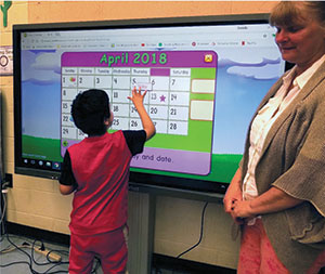 Forum student using Clear Touch interactive computer panel