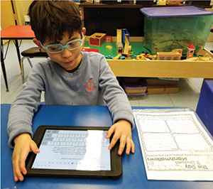 Forum student using iPad in classroom learning activity