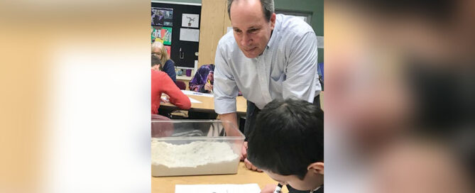 Jow Neubert working with a student