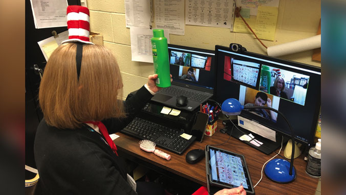 Forum teacher working with students virtually