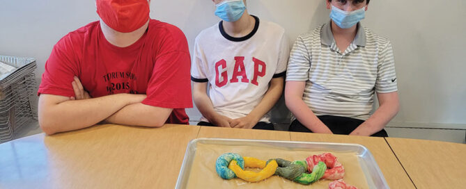 Students involved in baking in a professional kitchen