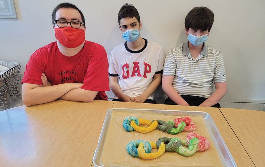 Students involved in baking in a professional kitchen