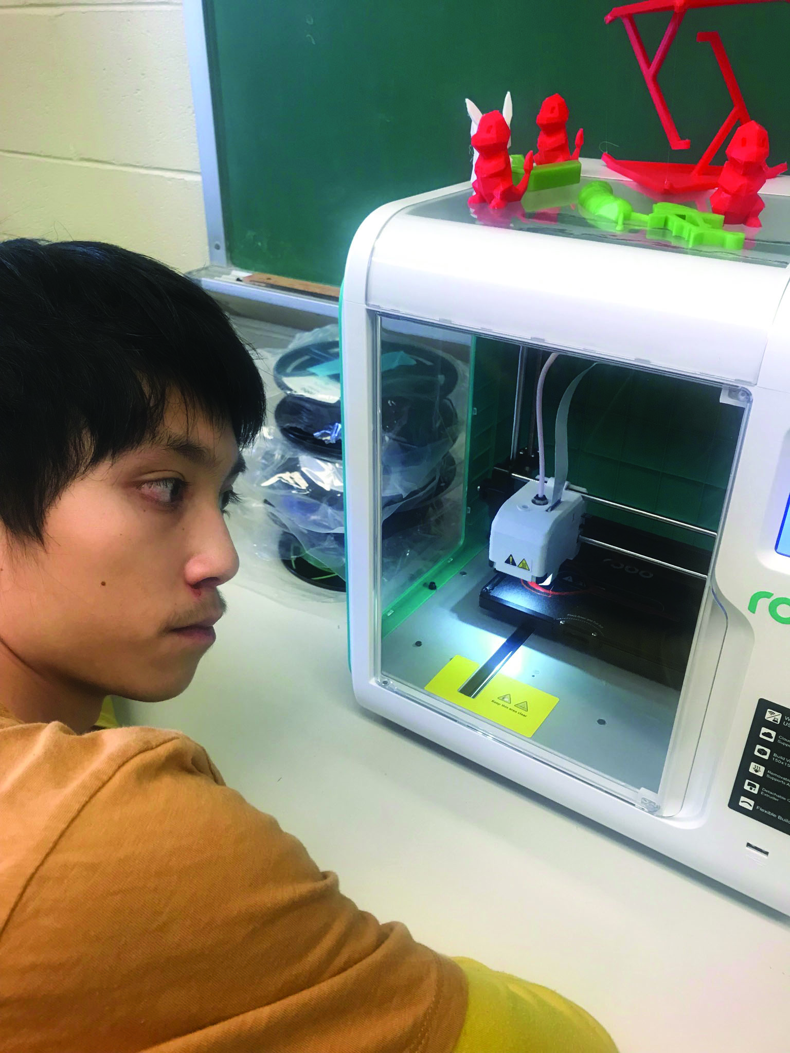 Forum student working with 3D printer