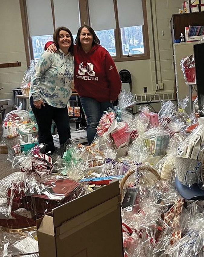 Danielle Italiano and Stacy Conroy helped  plan the event and assembled more than 200 baskets and prizes. 