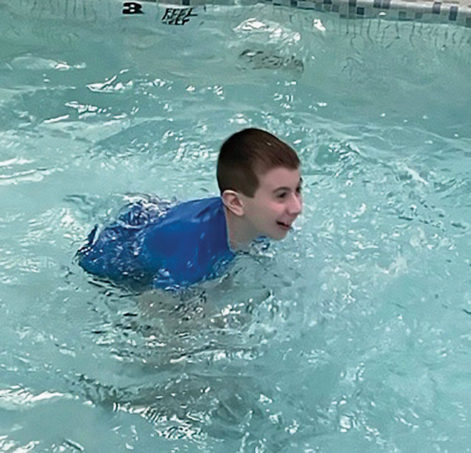 Forum student enjoying exercise in the school's on campus pool.