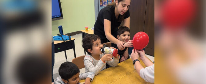 One of the Forum School teachers in the Early Education Professional Learning Community works with her students.